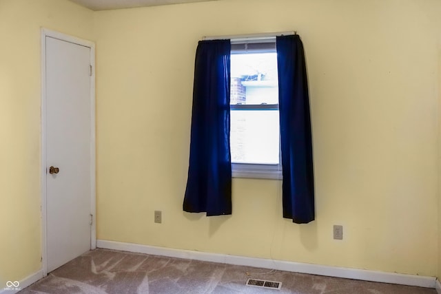 1020 E Sixth St, Greenfield, IN 46140 - carpeted empty room with healthy amount of natural light and baseboards