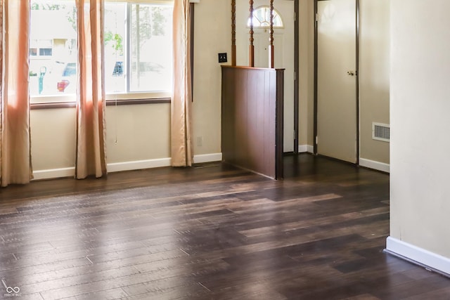 1020 E Sixth St, Greenfield, IN 46140 - spare room featuring dark wood-style flooring and baseboards