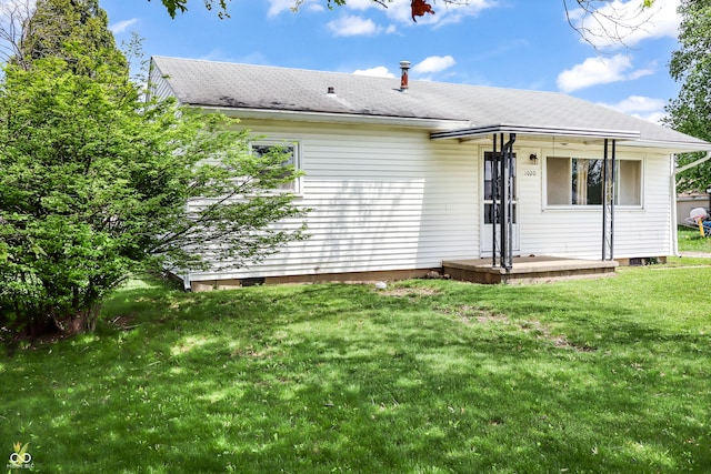 1020 E Sixth St, Greenfield, IN 46140 - rear view of house featuring a lawn and roof with shingles