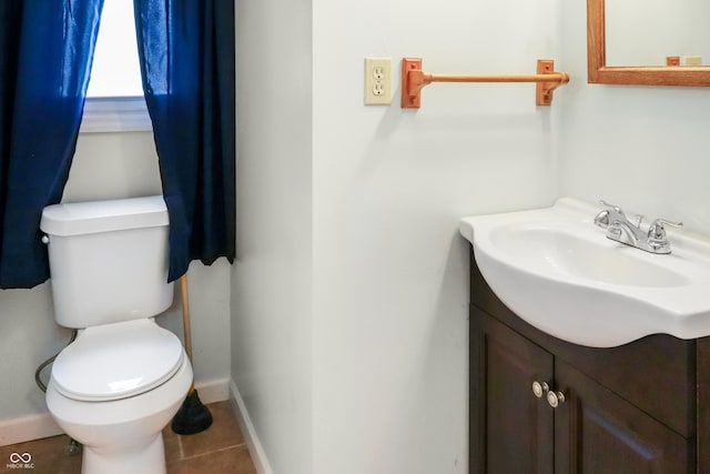 1020 E Sixth St, Greenfield, IN 46140 - bathroom with vanity, toilet, baseboards, and tile patterned flooring