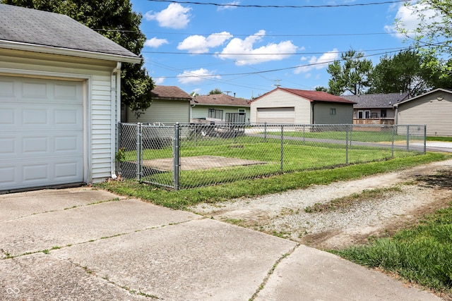 1020 E Sixth St, Greenfield, IN 46140 - view of side of property featuring a gate, an outdoor structure, and a garage