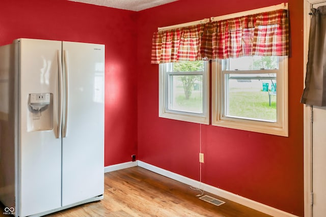 1020 E Sixth St, Greenfield, IN 46140 - unfurnished dining area featuring wood finished floors and baseboards