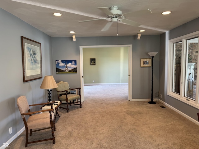 sitting room with carpet, baseboards, a ceiling fan, and recessed lighting