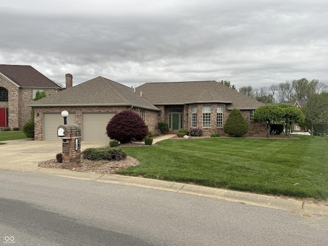 view of front of property with concrete driveway, a shingled roof, an attached garage, a front lawn, and a chimney