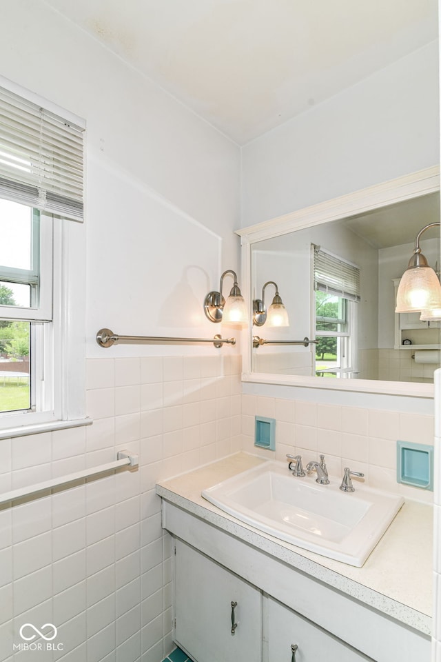 bathroom with tile walls and vanity