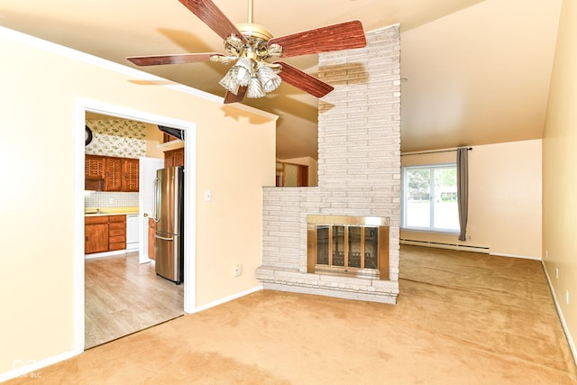 unfurnished living room with a baseboard radiator, ceiling fan, light carpet, baseboards, and a brick fireplace