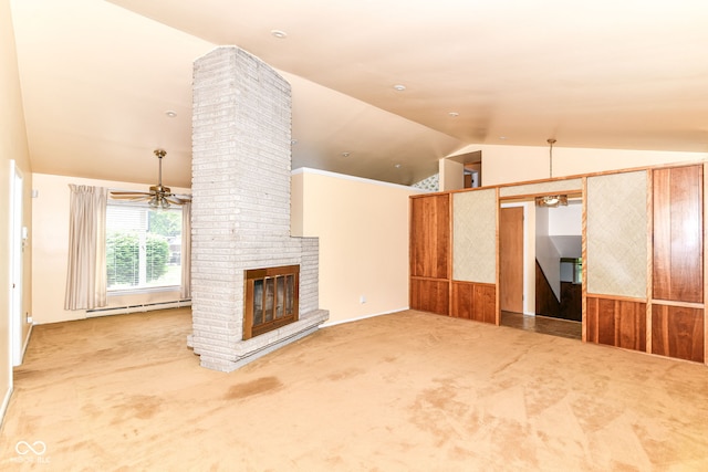 unfurnished living room with a baseboard radiator, a ceiling fan, vaulted ceiling, a brick fireplace, and carpet floors