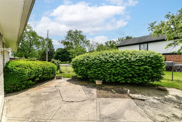 view of patio featuring fence