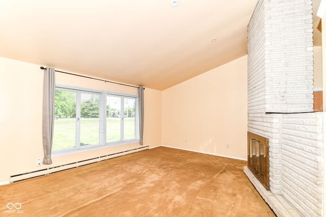 carpeted empty room with baseboard heating, lofted ceiling, a brick fireplace, and baseboards