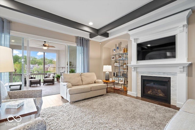 1013 Domino Dr, Carmel, IN 46032 - living area featuring recessed lighting, ceiling fan, a glass covered fireplace, and wood finished floors