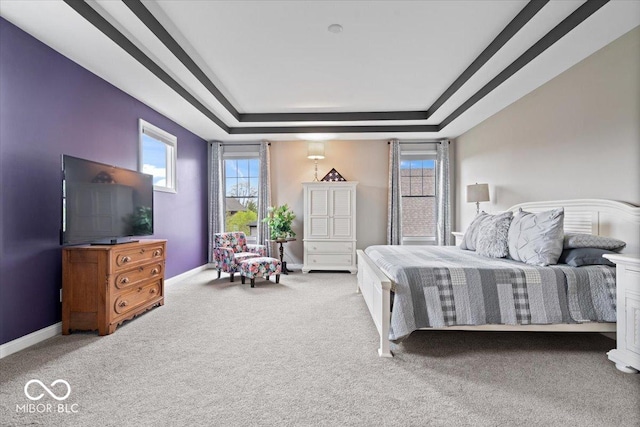 1013 Domino Dr, Carmel, IN 46032 - carpeted bedroom with a tray ceiling and baseboards