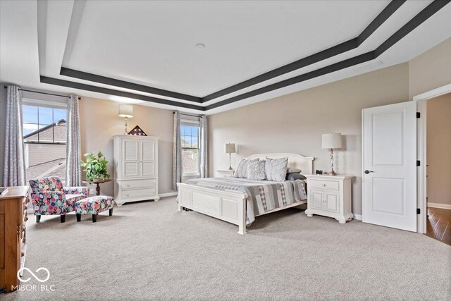1013 Domino Dr, Carmel, IN 46032 - carpeted bedroom featuring a raised ceiling, multiple windows, baseboards, and visible vents