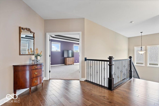 1013 Domino Dr, Carmel, IN 46032 - hallway featuring baseboards, an upstairs landing, and wood finished floors