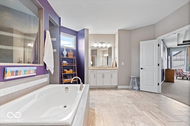 1013 Domino Dr, Carmel, IN 46032 - bathroom with baseboards, a garden tub, and vanity