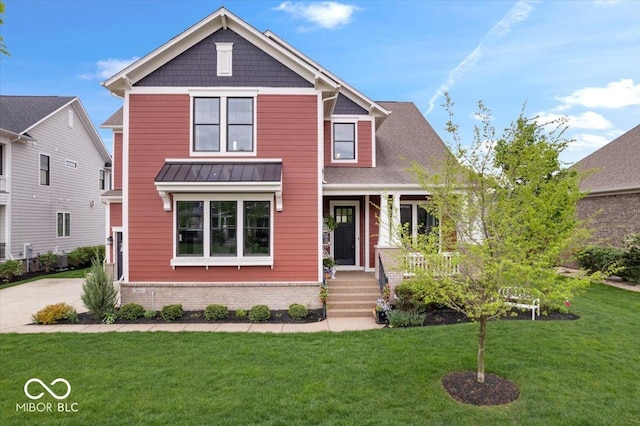 1013 Domino Dr, Carmel, IN 46032 - craftsman-style home with a standing seam roof, covered porch, brick siding, and a front yard