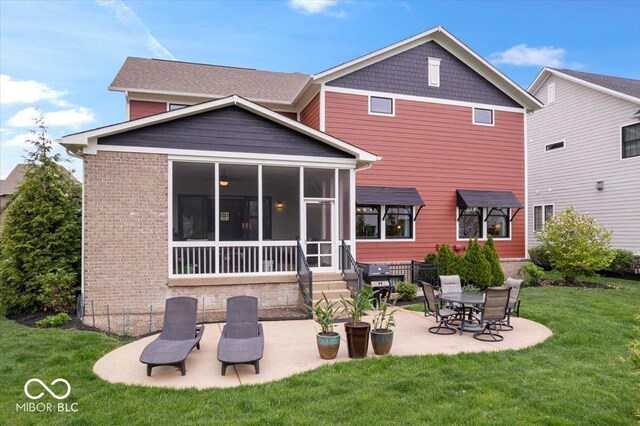 1013 Domino Dr, Carmel, IN 46032 - back of property featuring a patio, brick siding, a yard, and a sunroom