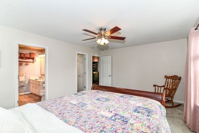 12092 Sugar Creek Rd, Noblesville, IN 46060 - bedroom with light colored carpet, baseboards, a sink, ensuite bathroom, and ceiling fan