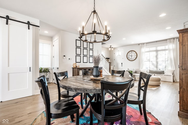 544 N Beville Ave, Indianapolis, IN 46201 - dining space featuring a barn door, stairs, light wood-style floors, recessed lighting, and a chandelier