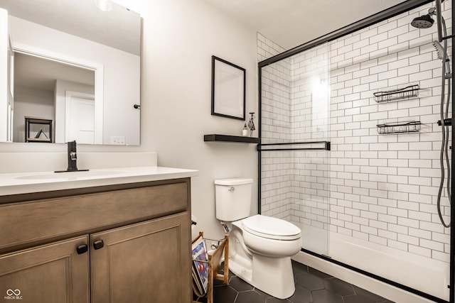 544 N Beville Ave, Indianapolis, IN 46201 - full bathroom featuring toilet, tile patterned floors, a shower stall, and vanity