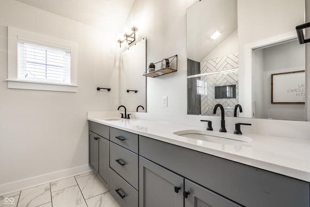 544 N Beville Ave, Indianapolis, IN 46201 - full bathroom with a stall shower, baseboards, marble look tiles, and double vanity