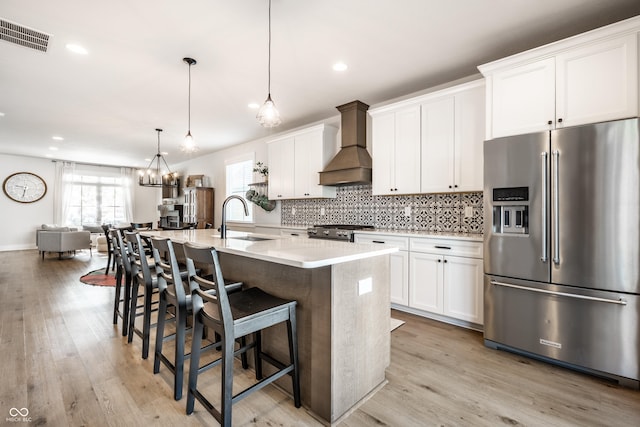 544 N Beville Ave, Indianapolis, IN 46201 - kitchen with appliances with stainless steel finishes, custom range hood, a sink, healthy amount of natural light, and recessed lighting