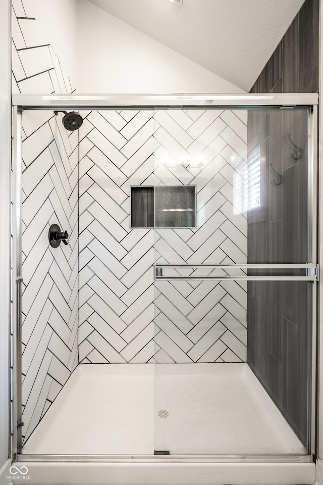 544 N Beville Ave, Indianapolis, IN 46201 - bathroom with vaulted ceiling and a stall shower