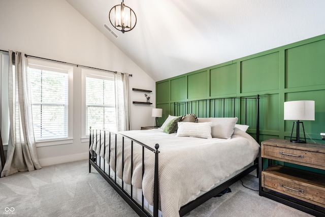 544 N Beville Ave, Indianapolis, IN 46201 - bedroom with light carpet, vaulted ceiling, a decorative wall, a chandelier, and baseboards