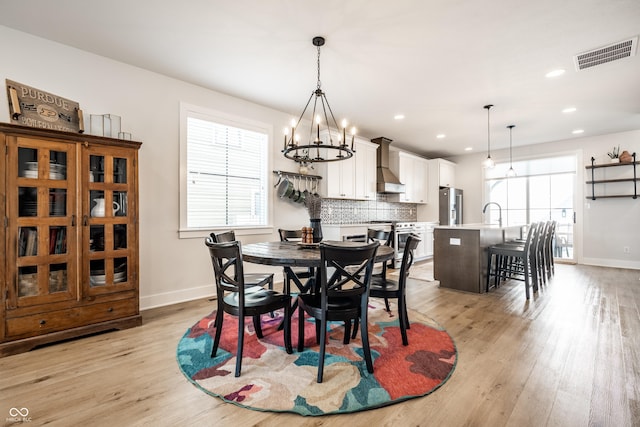 544 N Beville Ave, Indianapolis, IN 46201 - dining area with a chandelier, light wood-style flooring, baseboards, and recessed lighting