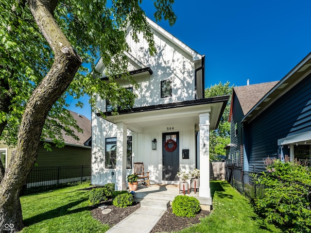544 N Beville Ave, Indianapolis, IN 46201 - view of front facade with board and batten siding and covered porch