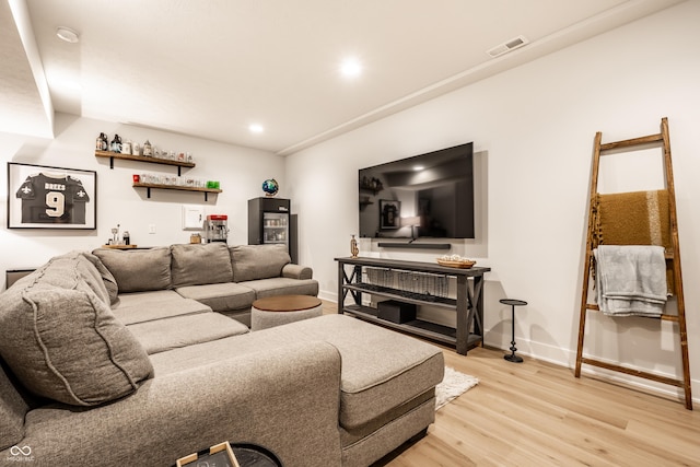 544 N Beville Ave, Indianapolis, IN 46201 - living room featuring bar area, light wood finished floors, baseboards, and recessed lighting