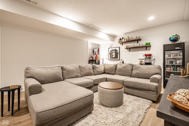 544 N Beville Ave, Indianapolis, IN 46201 - living room with bar area, light wood-style floors, wine cooler, and recessed lighting