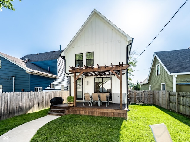 544 N Beville Ave, Indianapolis, IN 46201 - back of property featuring board and batten siding, a pergola, a wooden deck, and outdoor dining area
