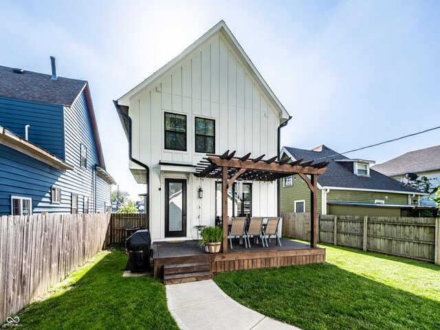 544 N Beville Ave, Indianapolis, IN 46201 - rear view of house with board and batten siding, a pergola, a deck, and outdoor dining space