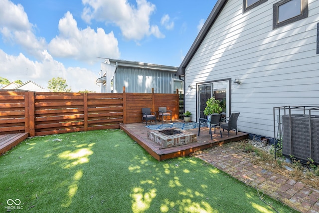 715 Terrace Ave, Indianapolis, IN 46203 - fenced yard with a deck and an outdoor fire pit