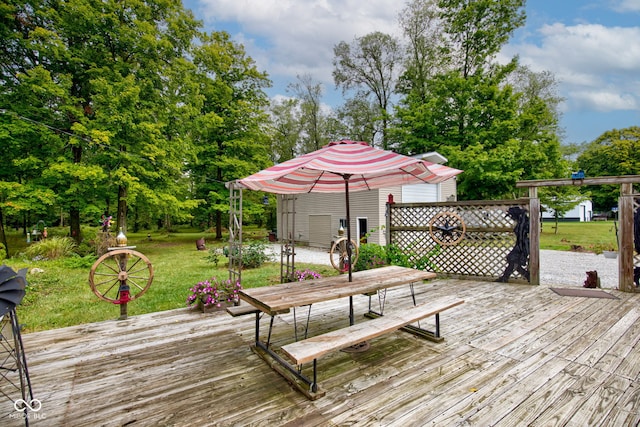 wooden terrace with a lawn