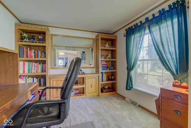 office area featuring visible vents, ornamental molding, a wealth of natural light, and light carpet