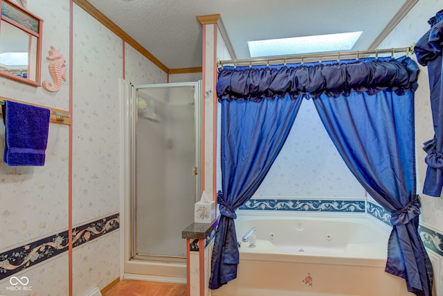 full bath with ornamental molding, a shower stall, a skylight, and wallpapered walls