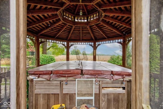 view of patio / terrace with a gazebo and a hot tub