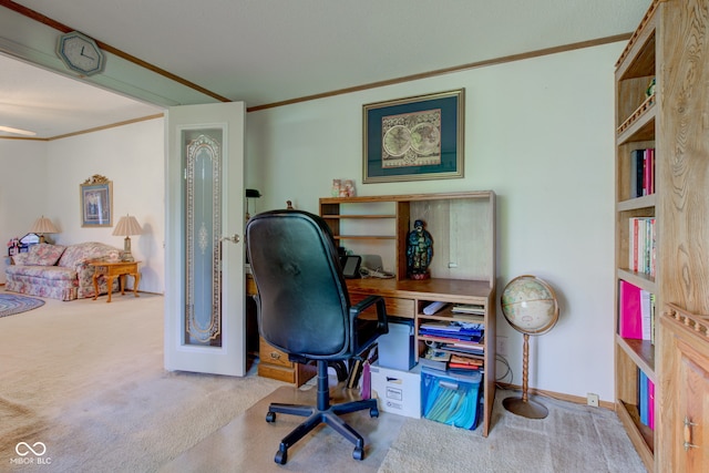 carpeted office with crown molding and baseboards