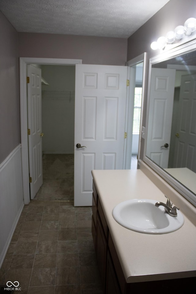 8912 Hosta Way, Indianapolis, IN 46113 - bathroom featuring vanity and a textured ceiling