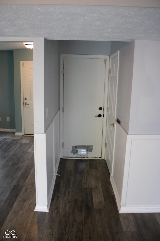 8912 Hosta Way, Indianapolis, IN 46113 - corridor with wood finished floors and a textured ceiling