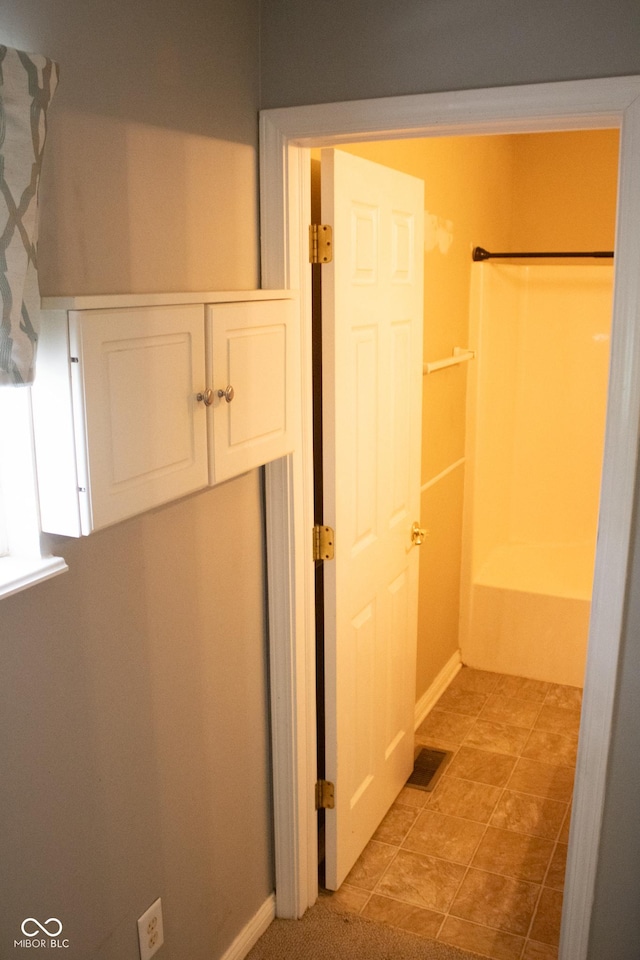 8912 Hosta Way, Indianapolis, IN 46113 - bathroom featuring bathing tub / shower combination and baseboards