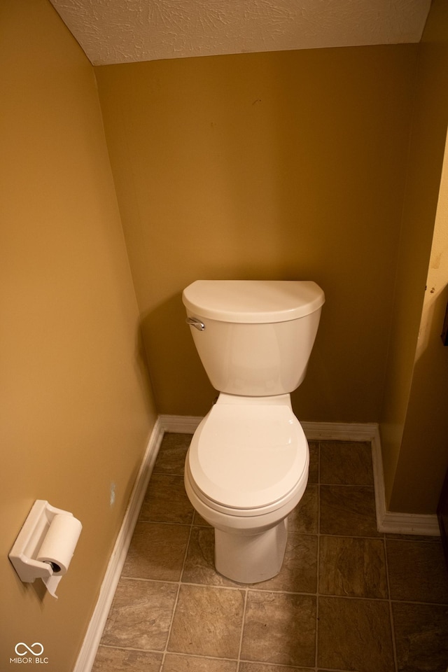 8912 Hosta Way, Indianapolis, IN 46113 - bathroom featuring a textured ceiling and tile patterned floors