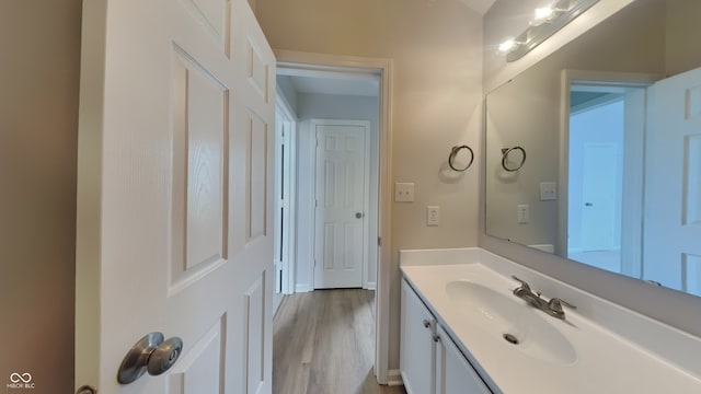 bathroom featuring vanity and wood finished floors