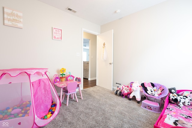 bedroom featuring visible vents and carpet floors