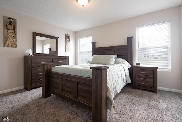 bedroom featuring carpet floors and baseboards