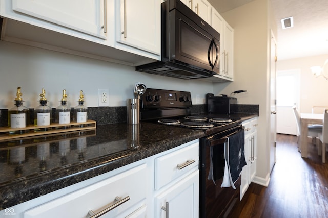 kitchen featuring black appliances, dark wood finished floors, white cabinets, and dark stone countertops