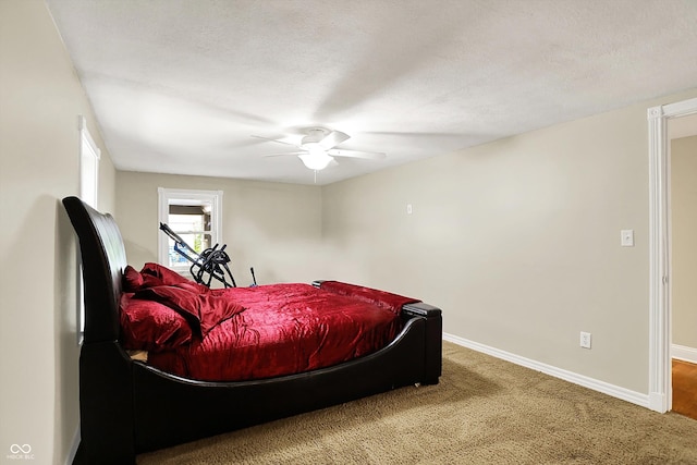bedroom featuring baseboards, carpet flooring, and a ceiling fan