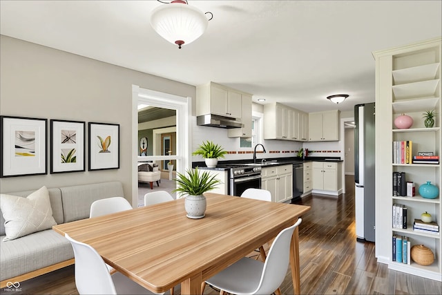 dining space featuring dark wood-style floors