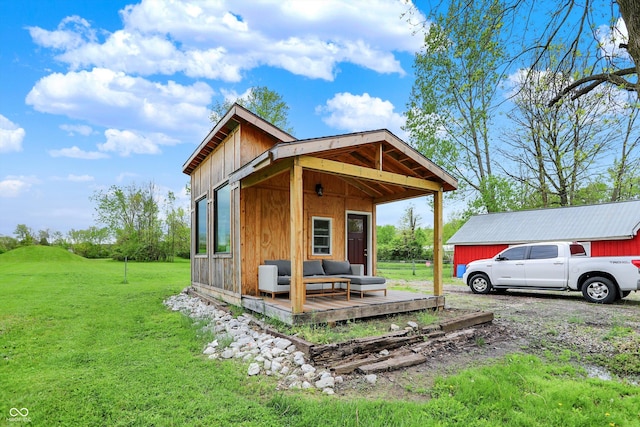 view of side of home with a lawn